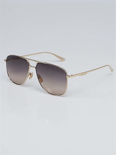 Gucci™ GG0336S Aviator Sunglasses .